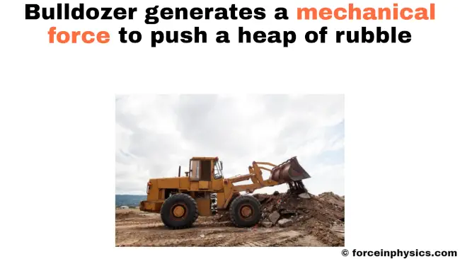 Mechanical force example - Bulldozer pushing a heap of rubble